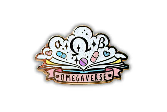enamel pin of an open book with a cloud of omegaverse symbols hearts and pills and underneath is a pink banner that says omegaverse