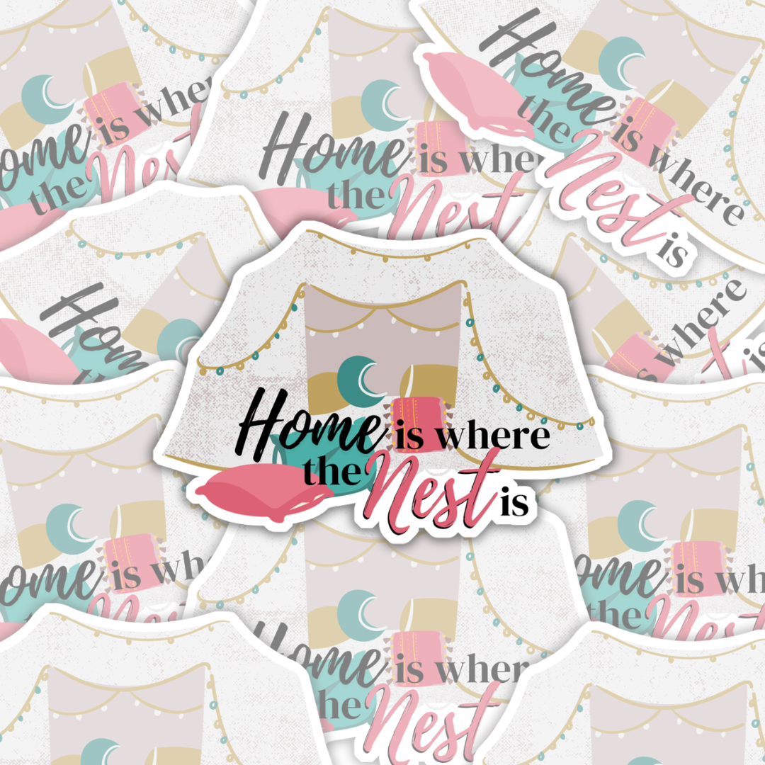 A vinyl omegaverse themed sticker that says "home is where the nest is" with a pillow fort full of teal, pink, and yellow pillows and string lights.