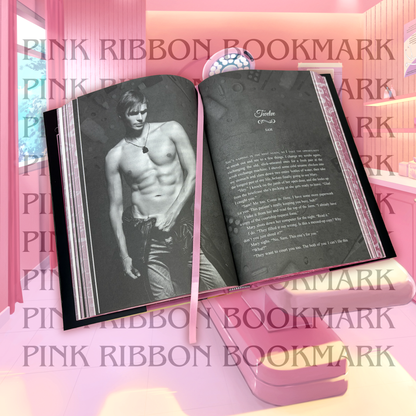 Open Heat Clinic book showing the point of view chapter header background for Sam and the pink ribbon bookmark.